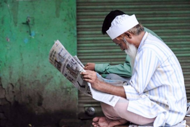 man reading newspaper