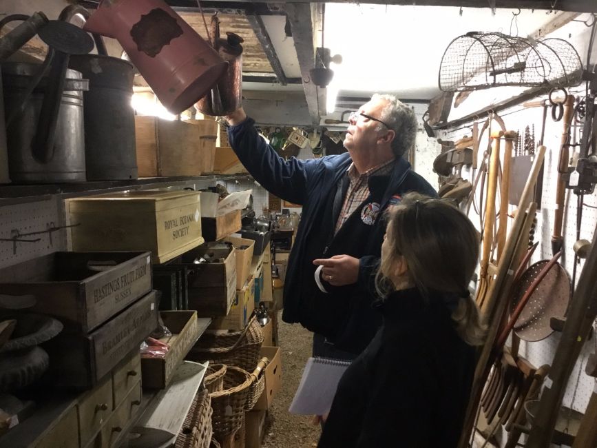inspecting a watering can