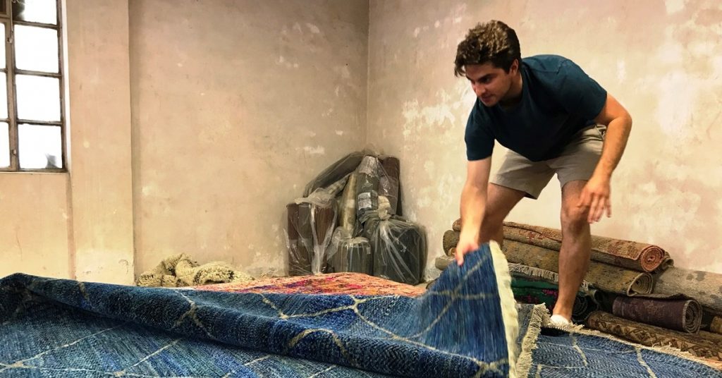 den with blue rug on a buying trip to India